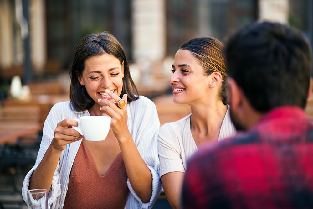 woman on a date with a polygamous couple