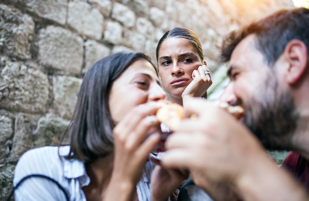 jealous polygamous woman looking at her partners